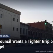 Fostoria News: Downtown Findlay buildings, with headline: Findlay Council Wants a Tighter Grip on the City Budget